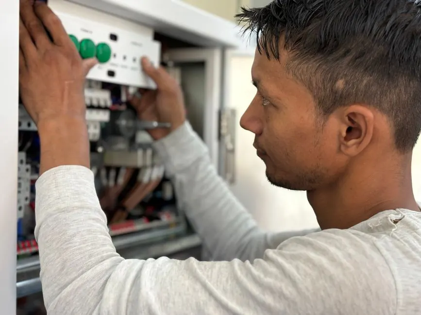 Technician using tools during a service visit